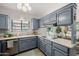 Well-lit kitchen featuring ample counter space and shaker style cabinets at 7615 E Tucson Rd, Scottsdale, AZ 85258