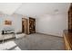 This large living room has a built-in bookcase and neutral carpet at 7615 E Tucson Rd, Scottsdale, AZ 85258