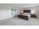Cozy main bedroom with neutral tones, a queen-size bed, and accent rug at 7615 E Tucson Rd, Scottsdale, AZ 85258