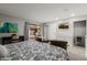 Bright main bedroom with a patio view, lounge seating, and stylish decor at 7615 E Tucson Rd, Scottsdale, AZ 85258