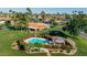 Inviting community pool area features colorful flowers, a charming gazebo, and manicured landscaping at 7615 E Tucson Rd, Scottsdale, AZ 85258