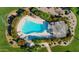 Aerial view of community pool surrounded by manicured landscaping and comfortable seating areas at 7615 E Tucson Rd, Scottsdale, AZ 85258
