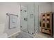 Modern shower with glass enclosure, stone flooring, and a built-in niche at 7615 E Tucson Rd, Scottsdale, AZ 85258