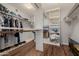 Spacious walk-in closet with ample shelving and hanging storage at 7615 E Tucson Rd, Scottsdale, AZ 85258
