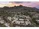 Panoramic aerial view of a residential area nestled against a mountain range, showcasing the neighborhood's layout at 7714 N 17Th Pl, Phoenix, AZ 85020