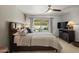 Bedroom with tile floors and a view to the pool at 7714 N 17Th Pl, Phoenix, AZ 85020