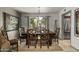 Formal dining room with a large table and chairs, plus a view to the backyard at 7714 N 17Th Pl, Phoenix, AZ 85020