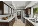 Modern kitchen boasting stainless steel appliances, dark wood cabinetry, and stone floors at 7714 N 17Th Pl, Phoenix, AZ 85020