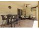 Relaxing covered patio featuring comfortable seating, a ceiling fan, and stylish outdoor decor at 7714 N 17Th Pl, Phoenix, AZ 85020