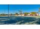 Community basketball court with shaded seating area and attractive desert landscaping at 8061 E Glenrosa Ave, Scottsdale, AZ 85251