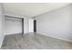 Large bedroom with plank floors and neutral walls at 8061 E Glenrosa Ave, Scottsdale, AZ 85251