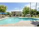 Community pool with lounge seating and landscaped surroundings at 8061 E Glenrosa Ave, Scottsdale, AZ 85251