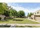 Sprawling outdoor green space and courtyard showing mature shade trees and building access at 8061 E Glenrosa Ave, Scottsdale, AZ 85251