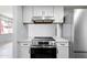 Bright kitchen with modern appliances including a stainless steel range and refrigerator at 8061 E Glenrosa Ave, Scottsdale, AZ 85251