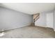 Spacious living room with new wood floors, neutral gray paint, and open staircase at 8061 E Glenrosa Ave, Scottsdale, AZ 85251