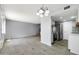 Open concept living room and kitchen showcasing new stainless appliances and stylish flooring at 8061 E Glenrosa Ave, Scottsdale, AZ 85251