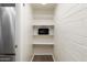 Pantry with lots of shelving. A microwave is on one of the shelves at 8061 E Glenrosa Ave, Scottsdale, AZ 85251