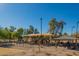 Community playground with swings, shade structures, and multiple seating options at 8061 E Glenrosa Ave, Scottsdale, AZ 85251