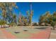 Outdoor recreation area showcasing horseshoe game and shade structures with mature trees at 8061 E Glenrosa Ave, Scottsdale, AZ 85251