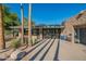 Community tennis center with gated access, shade trees, and well-maintained landscaping at 8061 E Glenrosa Ave, Scottsdale, AZ 85251