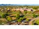 Aerial view of a park featuring green grass, trees, walking paths and buildings in the background at 8502 E Malcomb Dr, Scottsdale, AZ 85250