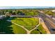 Neighborhood aerial view featuring manicured green spaces, a bridge, and convenient access to roadways at 8502 E Malcomb Dr, Scottsdale, AZ 85250