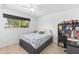 Cozy bedroom with a black bed frame, a bright window, and a desk at 8502 E Malcomb Dr, Scottsdale, AZ 85250