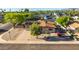 Well-kept single-story home with desert landscaping and mature trees at 8502 E Malcomb Dr, Scottsdale, AZ 85250