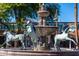 Beautiful fountain with Horse statures art piece in front of shops and restaurants at 8502 E Malcomb Dr, Scottsdale, AZ 85250