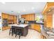 Spacious kitchen featuring custom wood cabinets, stainless steel appliances, and a large center island at 8502 E Malcomb Dr, Scottsdale, AZ 85250