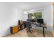 Well-lit home office space with multiple monitors, sleek desk, and comfortable chair at 8502 E Malcomb Dr, Scottsdale, AZ 85250