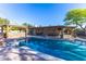 Stunning pool with a gazebo-covered outdoor kitchen, bar, and mature landscaping at 8502 E Malcomb Dr, Scottsdale, AZ 85250