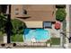 Aerial view showcases a private pool and backyard oasis with lush landscaping and outdoor seating at 8502 E Rose Ln, Scottsdale, AZ 85250