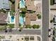 Aerial view of neighborhood highlighting a well-maintained home with a private pool at 8502 E Rose Ln, Scottsdale, AZ 85250
