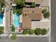 A lovely aerial view showcases the backyard pool and landscaping of this beautiful single-Gathering home at 8502 E Rose Ln, Scottsdale, AZ 85250