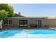 Inviting backyard pool with covered patio, perfect for outdoor entertaining and relaxation at 8502 E Rose Ln, Scottsdale, AZ 85250