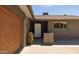 Inviting home exterior featuring a stylish front door, brick accents, and a well-manicured yard at 8502 E Rose Ln, Scottsdale, AZ 85250