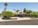 Charming single-story home with desert landscaping, mature trees, and a spacious driveway at 8502 E Rose Ln, Scottsdale, AZ 85250