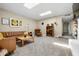 Inviting living room with comfortable seating, skylights, and stylish decor at 8502 E Rose Ln, Scottsdale, AZ 85250