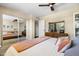 Bright main bedroom featuring a mirrored closet, dresser and neutral accents throughout the room at 8502 E Rose Ln, Scottsdale, AZ 85250
