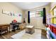 room with laminate floors, table, keyboard and room to play at 8502 E Rose Ln, Scottsdale, AZ 85250