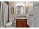 Cozy bathroom featuring a granite countertop and warm wood vanity at 8644 E Roanoke Ave, Scottsdale, AZ 85257