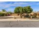 A beautiful single-story home features an iron fence and mature trees at 8644 E Roanoke Ave, Scottsdale, AZ 85257