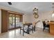 Kitchen area featuring tile flooring, stylish light fixture and French doors at 8644 E Roanoke Ave, Scottsdale, AZ 85257
