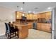 Stylish kitchen with sleek stainless steel appliances and wood cabinetry at 8644 E Roanoke Ave, Scottsdale, AZ 85257