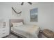 Comfortable bedroom with a ceiling fan, natural light, and a cozy decor at 8715 W Agora Ln, Tolleson, AZ 85353