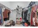 Spacious walk-in closet with ample hanging space, shelving, and storage solutions at 8715 W Agora Ln, Tolleson, AZ 85353