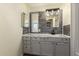 Bathroom features modern vanity and an illuminated mirror at 9710 E Baywood Ave, Mesa, AZ 85208