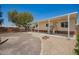 Welcoming home with a covered porch, enhanced by meticulous landscaping, offering a serene outdoor space and curb appeal at 9710 E Baywood Ave, Mesa, AZ 85208