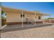 Inviting home exterior showcasing covered porch, neutral siding and xeriscape landscaping at 9710 E Baywood Ave, Mesa, AZ 85208